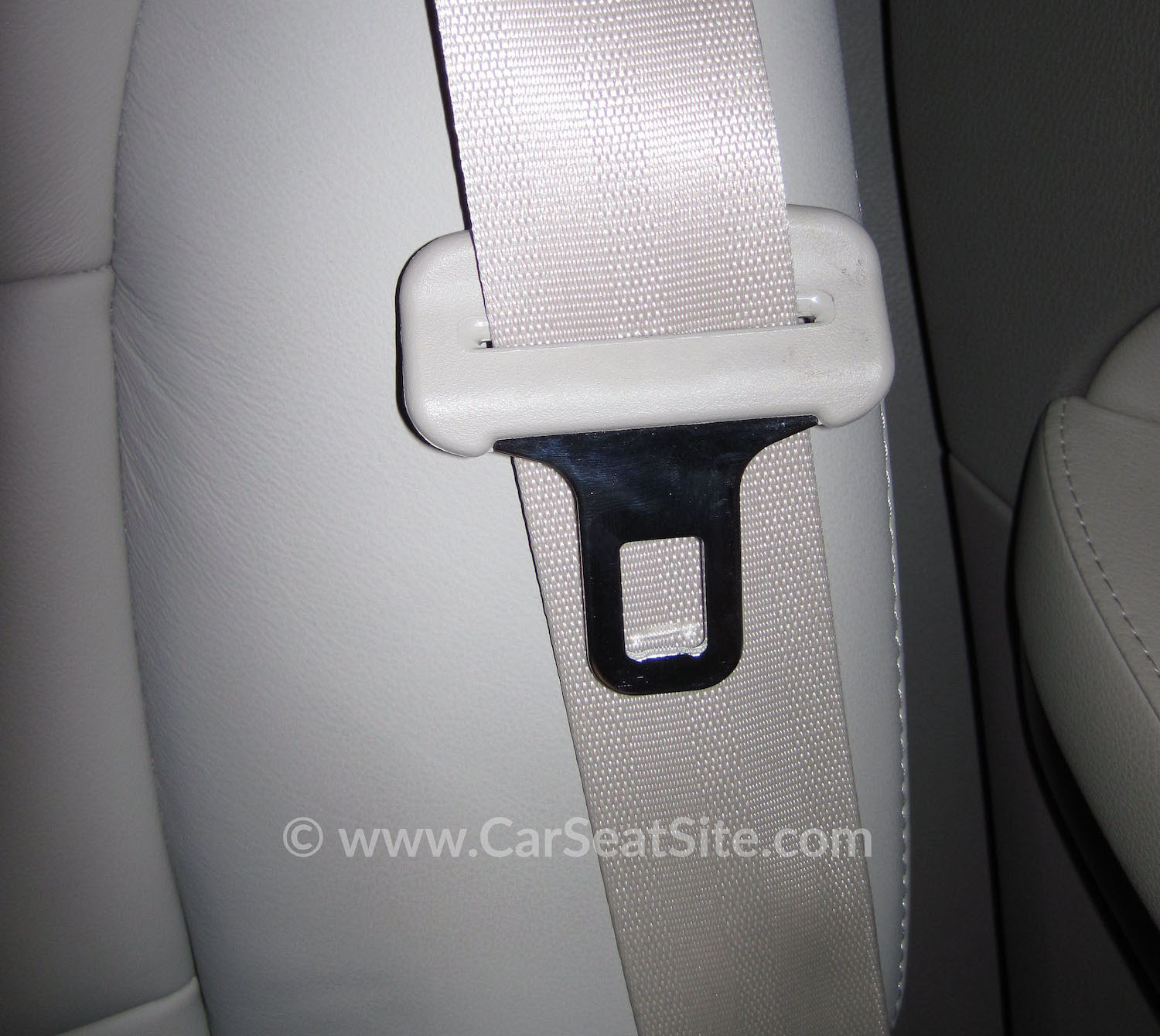 seat belt slide stop button